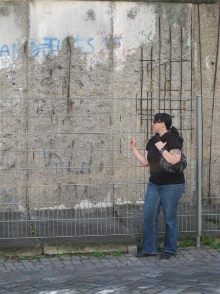Standing at part of the former Berlin Wall.  2008.